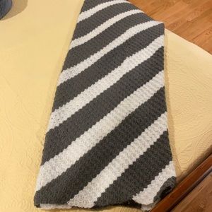 gray and white handmade throw blanket